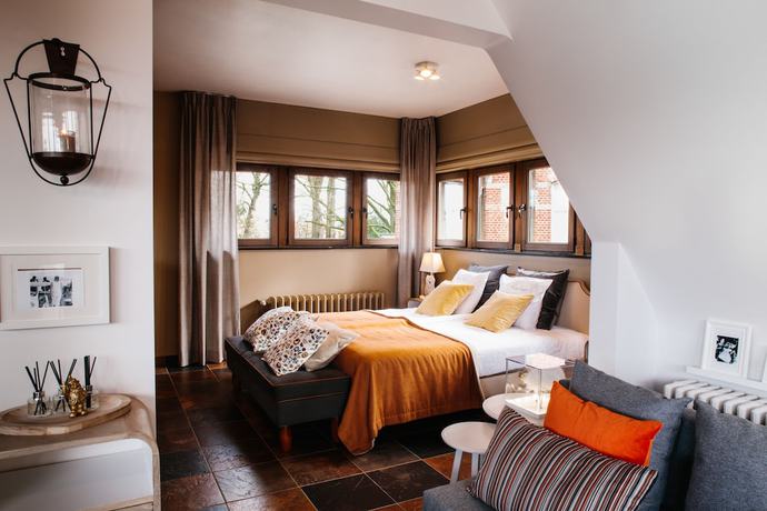 Imagen de la habitación del Hotel Charmehotel Manoir Ogygia. Foto 11