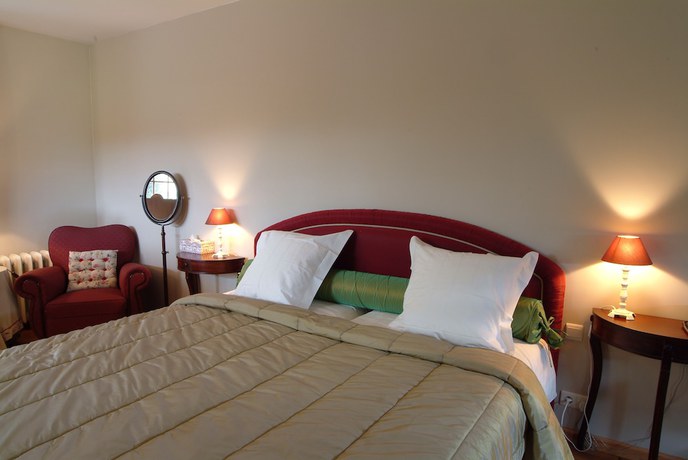 Imagen de la habitación del Hotel Charmehotel Manoir Ogygia. Foto 12