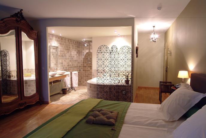 Imagen de la habitación del Hotel Charmehotel Manoir Ogygia. Foto 13