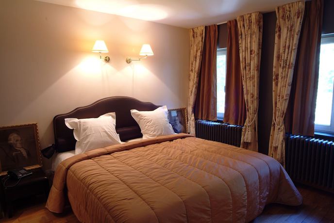 Imagen de la habitación del Hotel Charmehotel Manoir Ogygia. Foto 16