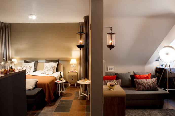 Imagen de la habitación del Hotel Charmehotel Manoir Ogygia. Foto 17