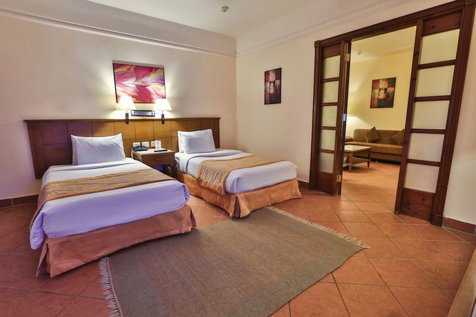 Imagen de la habitación del Hotel Charmillion Gardens Aquapark. Foto 8