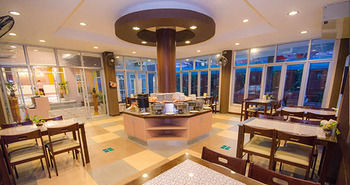 Imagen de la habitación del Hotel Charoenchit House. Foto 5
