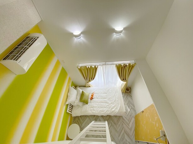 Imagen de la habitación del Hotel Chatan Tall House. Foto 30