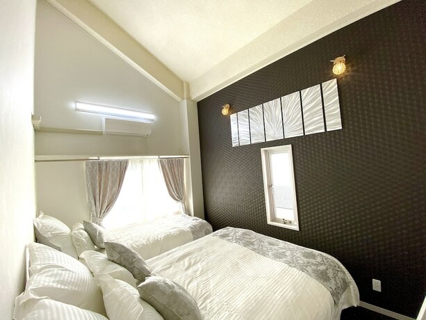 Imagen de la habitación del Hotel Chatan Tall House. Foto 34