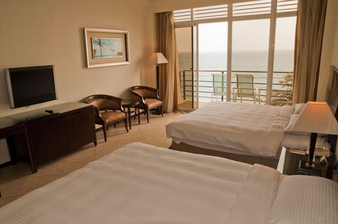 Imagen de la habitación del Hotel Chateau Beach Resort. Foto 13