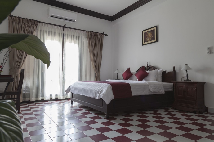 Imagen de la habitación del Hotel Chateau D'angkor La Residence. Foto 11
