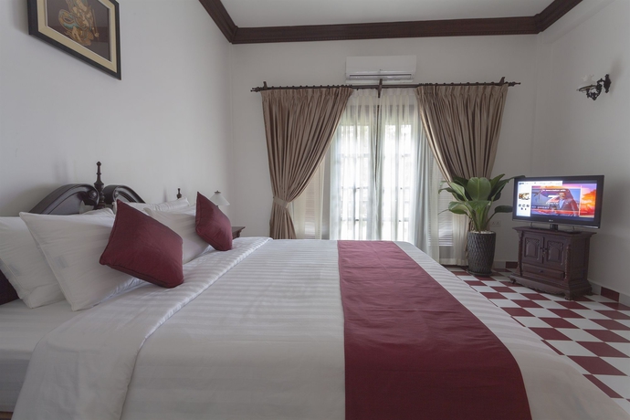 Imagen de la habitación del Hotel Chateau D'angkor La Residence. Foto 12