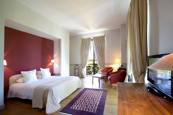 Imagen de la habitación del Hotel Chateau Grattequina. Foto 9