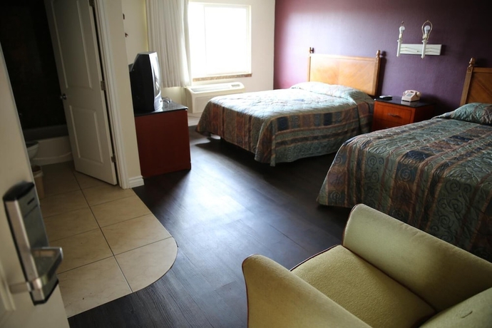 Imagen de la habitación del Hotel Chateau Inn and Suites. Foto 12