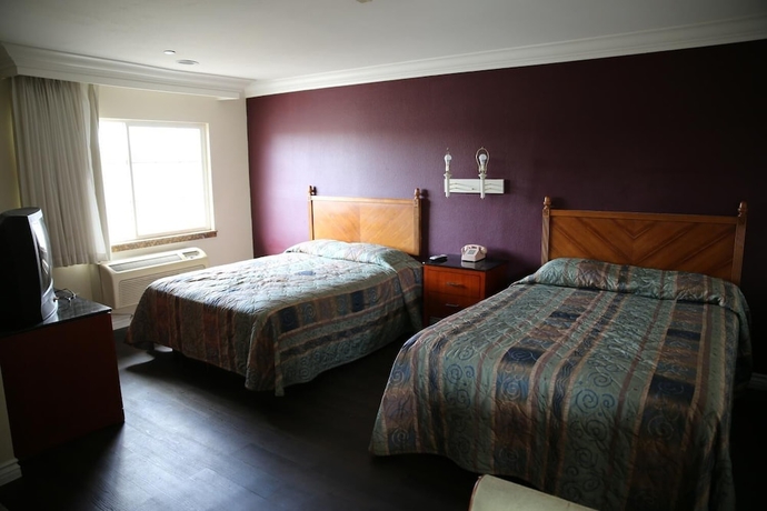 Imagen de la habitación del Hotel Chateau Inn and Suites. Foto 13