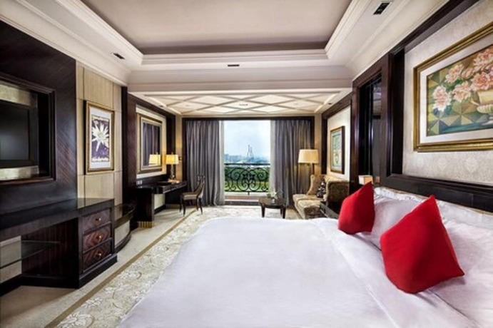 Imagen de la habitación del Hotel Chateau Star River Qing Dao. Foto 11