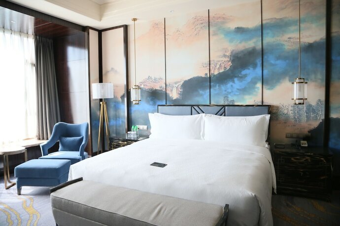 Imagen de la habitación del Hotel Chateau Star River Qing Dao. Foto 12