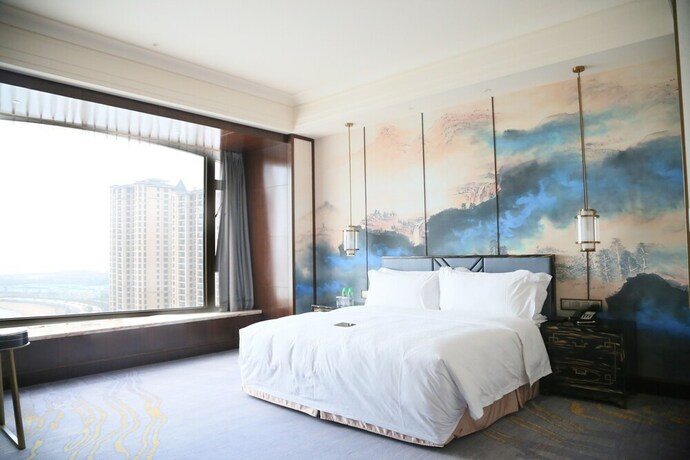 Imagen de la habitación del Hotel Chateau Star River Qing Dao. Foto 14