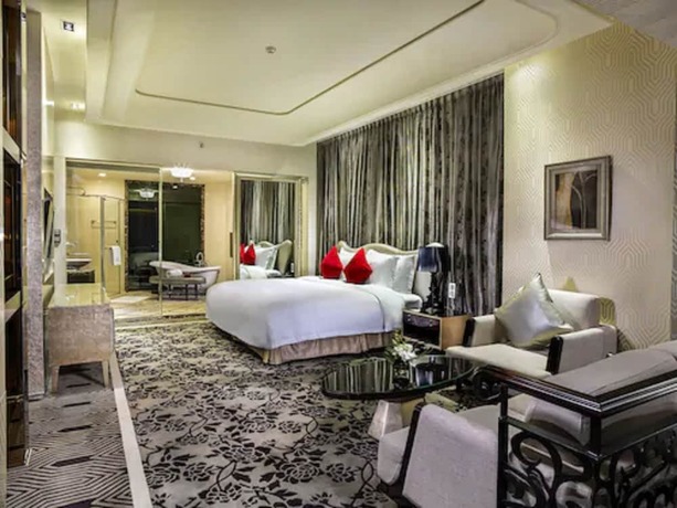 Imagen de la habitación del Hotel Chateau Star River Qing Dao. Foto 16