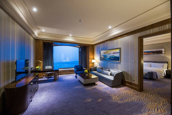 Imagen de la habitación del Hotel Chateau Star River Qing Dao. Foto 17