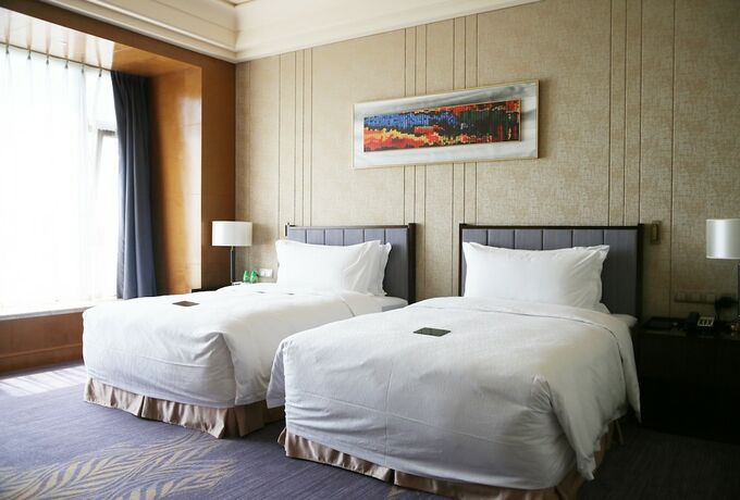 Imagen de la habitación del Hotel Chateau Star River Qing Dao. Foto 20