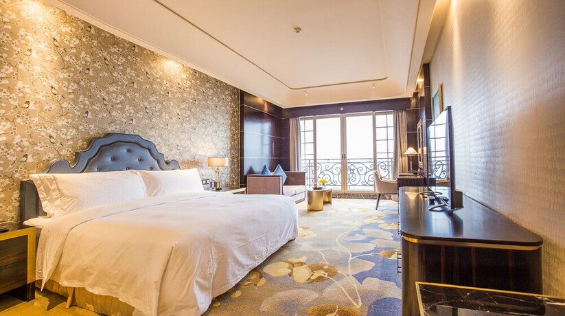 Imagen de la habitación del Hotel Chateau Star River Qing Dao. Foto 21