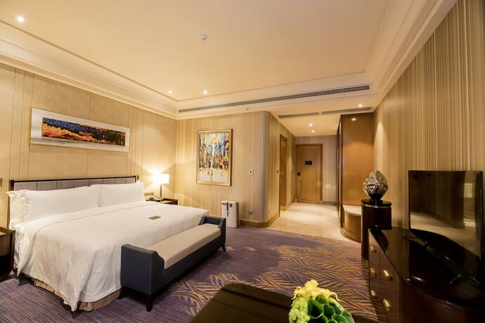 Imagen de la habitación del Hotel Chateau Star River Qing Dao. Foto 23