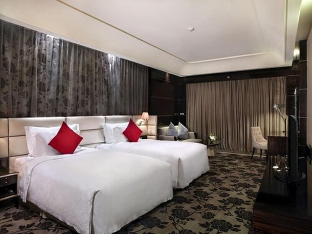 Imagen de la habitación del Hotel Chateau Star River Qing Dao. Foto 25