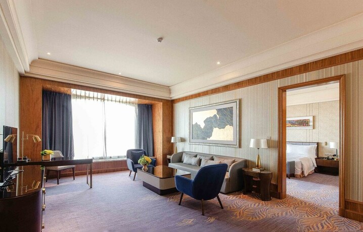 Imagen de la habitación del Hotel Chateau Star River Qing Dao. Foto 26