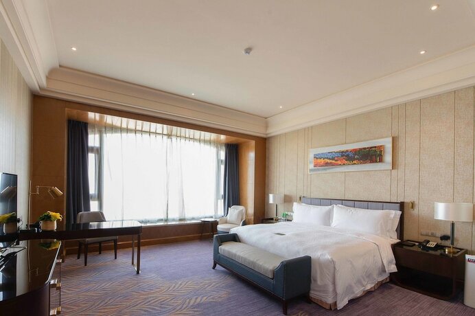 Imagen de la habitación del Hotel Chateau Star River Qing Dao. Foto 27