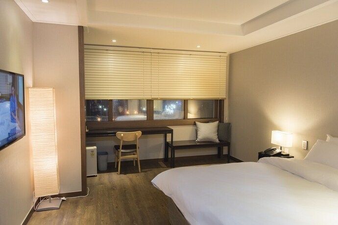 Imagen de la habitación del Hotel Check Inn Jeju. Foto 16
