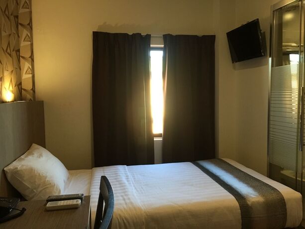 Imagen de la habitación del Hotel Check Inn Tawau. Foto 12