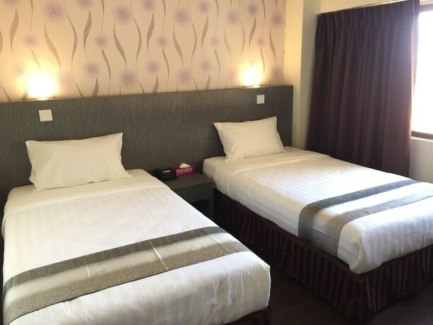 Imagen de la habitación del Hotel Check Inn Tawau. Foto 17
