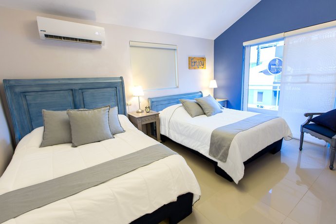 Imagen de la habitación del Hotel Checkin El Cortecito Beach. Foto 2