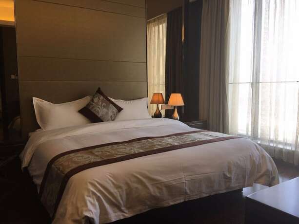 Imagen de la habitación del Hotel Checkinn Business Apartment-poly World. Foto 13