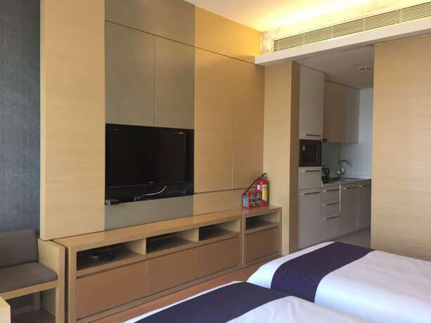 Imagen de la habitación del Hotel Checkinn Business Apartment-poly World. Foto 17