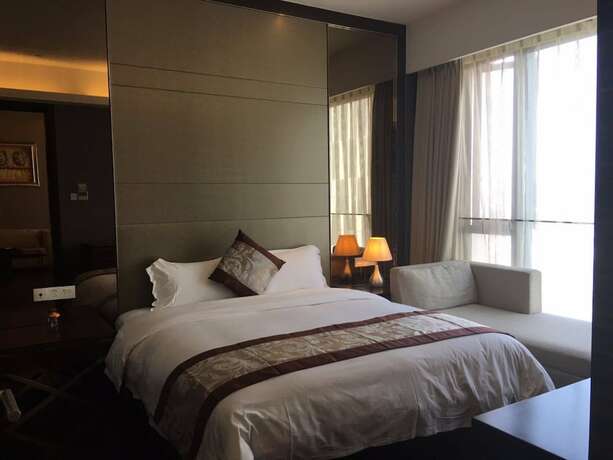 Imagen de la habitación del Hotel Checkinn Business Apartment-poly World. Foto 22