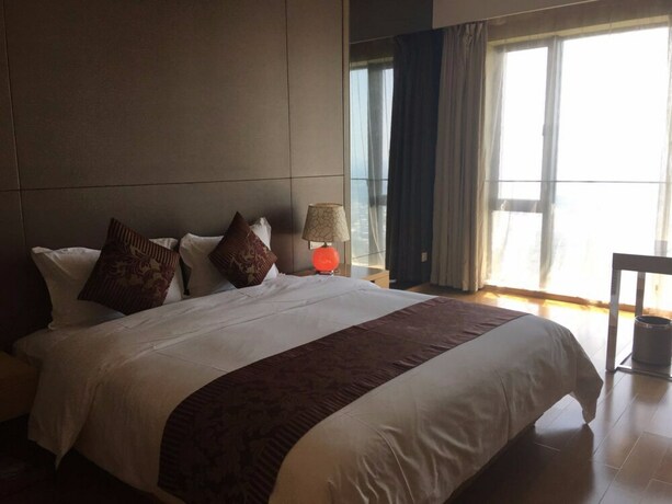 Imagen de la habitación del Hotel Checkinn Business Apartment-poly World. Foto 23