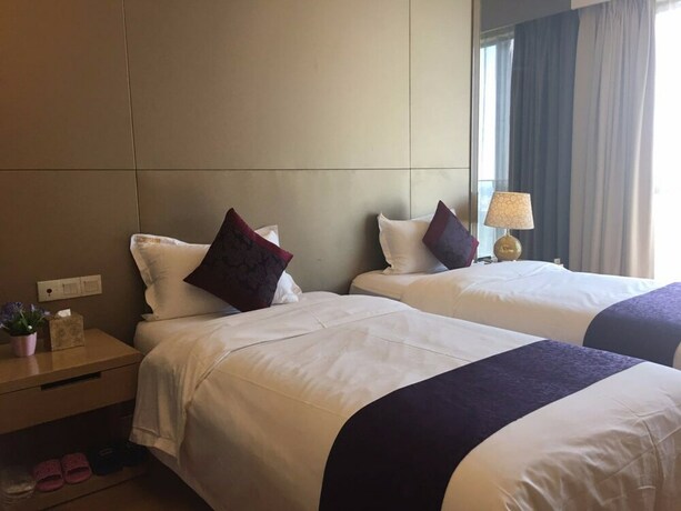 Imagen de la habitación del Hotel Checkinn Business Apartment-poly World. Foto 25