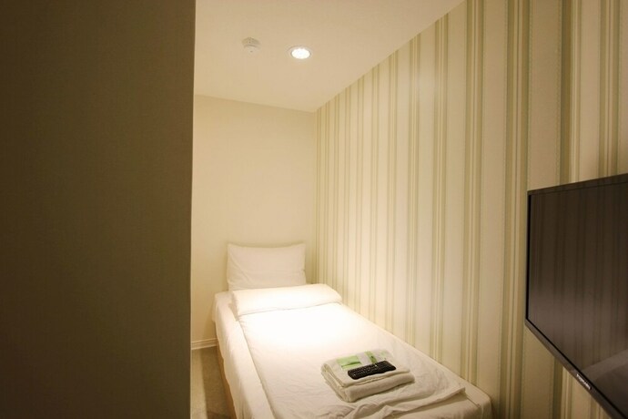 Imagen de la habitación del Hotel Cheers Loft. Foto 25
