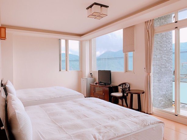 Imagen de la habitación del Hotel Chen Yi. Foto 12