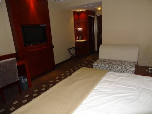 Imagen de la habitación del Hotel Chengde Huilong Tower. Foto 10