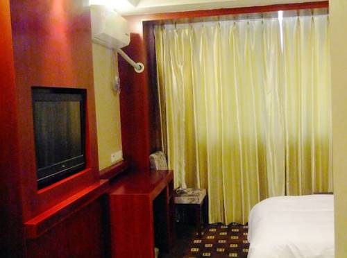 Imagen de la habitación del Hotel Chengde Huilong Tower. Foto 14