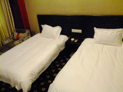 Imagen de la habitación del Hotel Chengde Huilong Tower. Foto 15