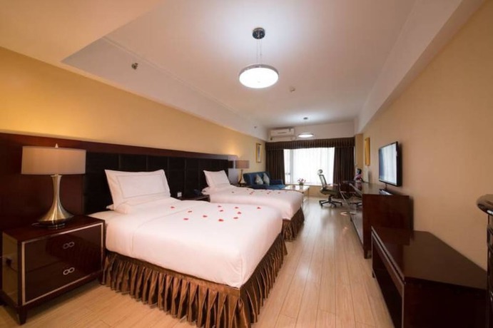 Imagen de la habitación del Hotel Chengdu Longhu Beach Hotel. Foto 8