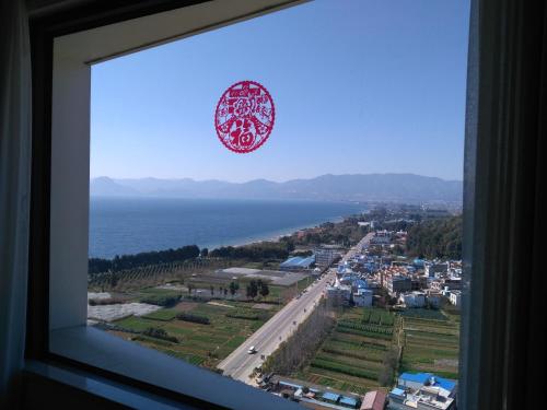 Imagen de la habitación del Hotel Chengjiang Hiya Holiday. Foto 7