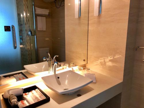 Imagen de la habitación del Hotel Chengjiang Hiya Holiday. Foto 8