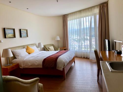 Imagen general del Hotel Chengjiang Hiya Holiday. Foto 6