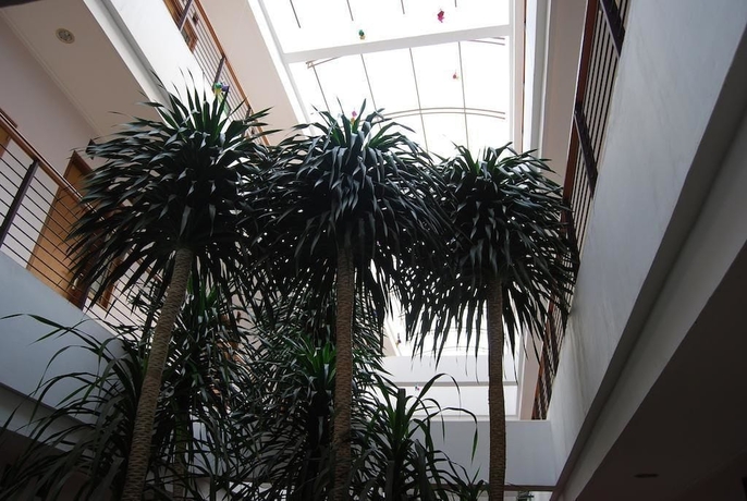 Imagen de los interiores del Hotel Cherry Homes And Residence. Foto 18