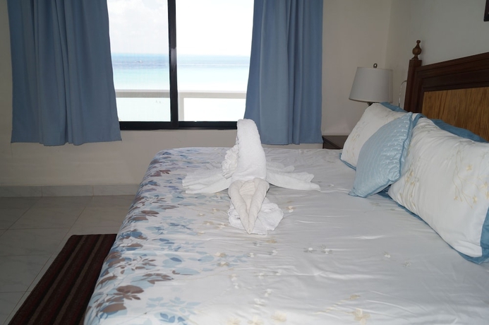 Imagen de la habitación del Hotel Chichis and Charlies Beachfront. Foto 7