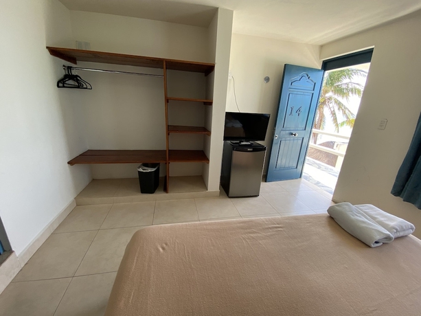 Imagen de la habitación del Hotel Chichis and Charlies Beachfront. Foto 8