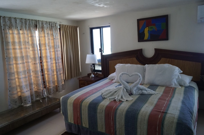 Imagen de la habitación del Hotel Chichis and Charlies Beachfront. Foto 10