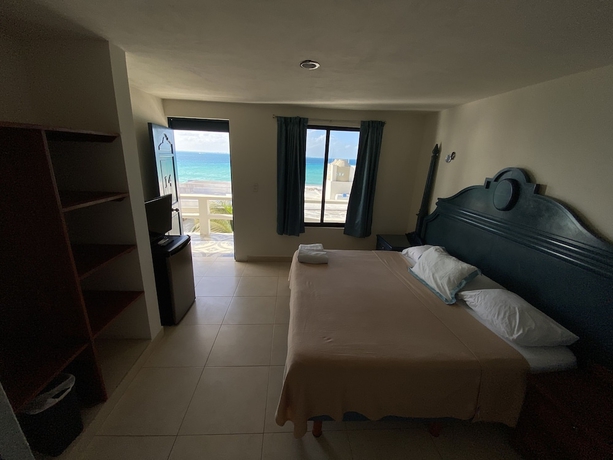 Imagen de la habitación del Hotel Chichis and Charlies Beachfront. Foto 15