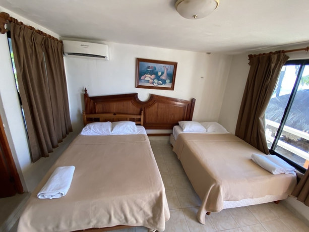 Imagen de la habitación del Hotel Chichis and Charlies Beachfront. Foto 17